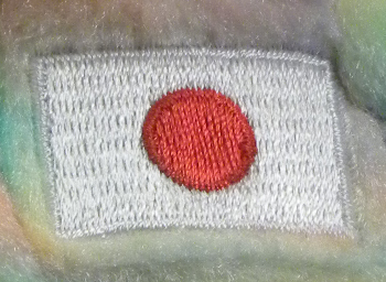 Ai - closeup of flag on chest